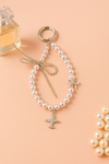 Pearl Phone Charm with Airplane & Bow Design